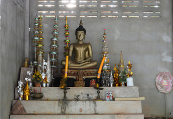 the buddha statue and some worship  .sacrifice in old room at the temple