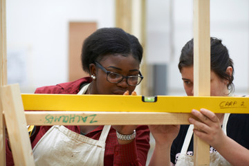 Student learning how to do building work