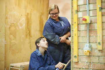 Student learning how to do building work