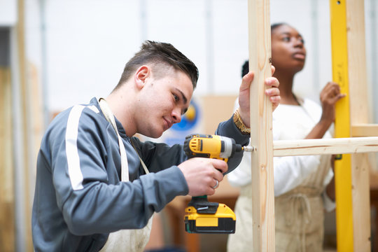 Student learning how to do building work
