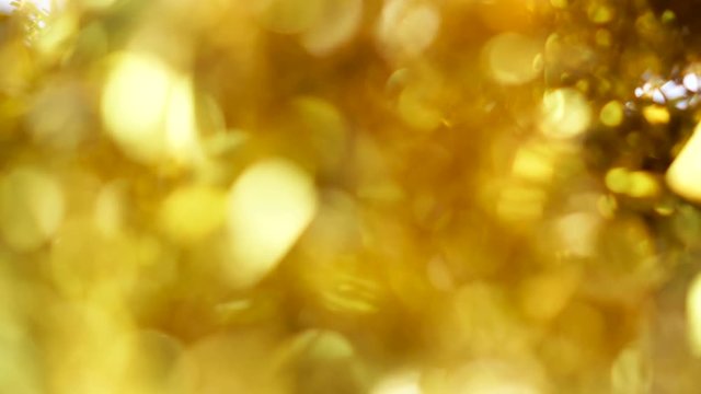Blur background of gold color bokeh light, Popular in the general festival. Make the luxury image in your work piece.