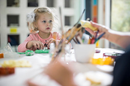 Girl playing with clay