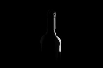 wine bottle on black background - black and white photo