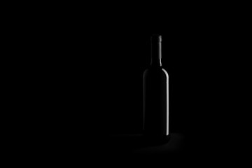 wine bottle on black background - black and white photo