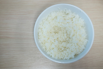 Cooked rice in round white bowl