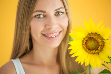 A woman is wearing braces 
