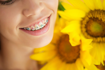 A woman is wearing braces 

