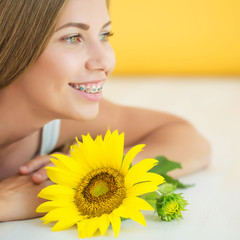 A woman is wearing braces 

