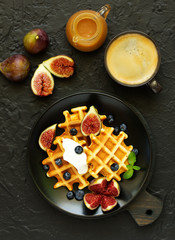 Homemade waffles with caramel and figs.