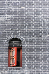 Small red window in a brick wall, Chengdu, China
