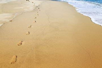Footprints in sand beach