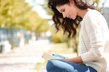 lovely beautiful woman in a woolen sweater relaxes.