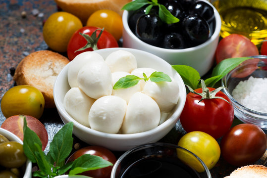 mozzarella, fresh ingredients for the salad and bread