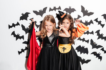 Couple of two scary little girls dressed in halloween costumes