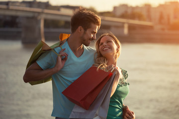 Young happy couple shopping together.