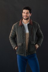 Fototapeta premium Man posing against black background