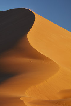 Sand dune shifting in wind