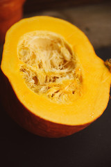 Set of orange pumpkins on wood flat lay free space. Fresh cut squashes on wooden table, country autumn background. Seasonal, harvest, fall, organic food, dieting, healthy food concept