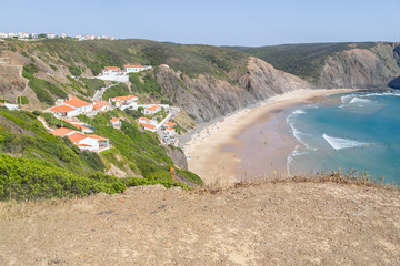 Cliffs, beach and houses in Arrifana