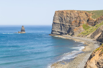 Trail, Cliffs, beach, mountains and vegetation in Canal beach
