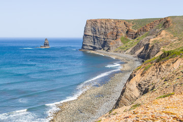 Trail, Cliffs, beach, mountains and vegetation in Canal beach