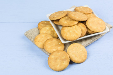 cracker on light blue wooden background