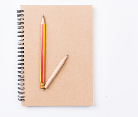 Flat lay,blank notebook and pencil isolated on white background