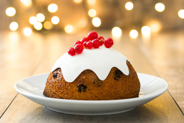 Christmas pudding with christmas light background
