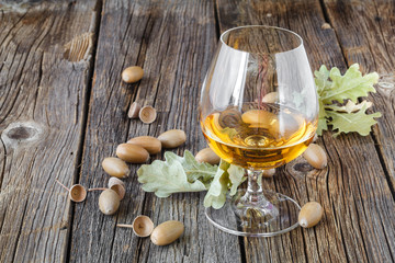 Relax with alcohol. Autumn oak and glass of whisky