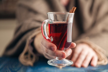 Homemade hot spiced wine in hand, mulled wine