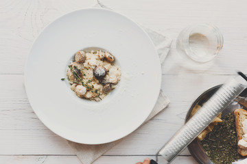 Wild mushrooms risotto with rosemary and parmesan, italian cuisine