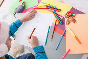 Child writing letter to santa, wait for christmas, top view