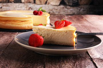 Homemade cheesecake with fresh strawberries and mint for dessert - healthy organic summer dessert pie cheesecake. Vanilla Cheese Cake.