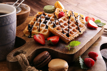 Belgian waffles with strawberries and raspberries, homemade healthy breakfast with coffee