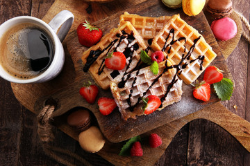 Belgian waffles with strawberries and raspberries, homemade healthy breakfast with coffee