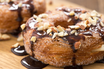Obraz na płótnie Canvas donuts chocolate on wood with sugar