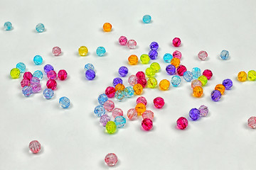 Colored beads for design on a white background
