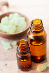 Frankincense essential oil on the wooden board