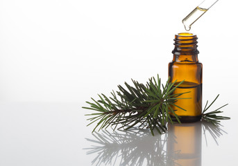 Pine essential oil and glass drops on white background - 172161103