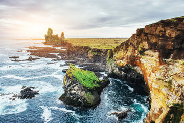 Fototapeta premium Reynisfjara black sand beach in Iceland. Reynisfyal Mountains
