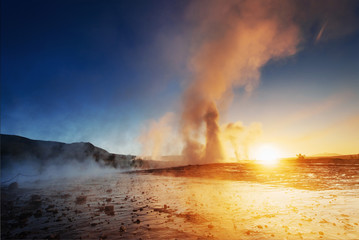 Strokkur geyser eruption in Iceland. Fantastic colors shine through the steam.