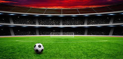 Soccer ball on green stadium