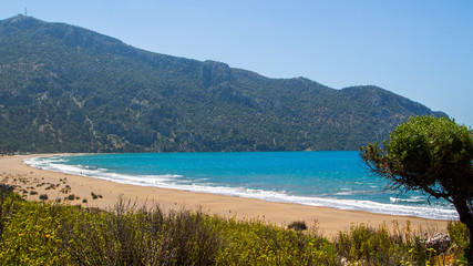 View of the beach from the cliff. Beautiful blue sea. Incredible landscape of the coast. Turkey