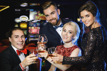 Happy people celebrating their win after successful game in the casino