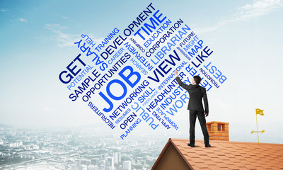 Young businessman standing on house roof and writing leadership skill concept. Mixed media
