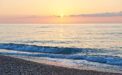 Colorful sunset over the sea from colliding waves. Nature composition