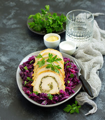Fried pork loin stuffed with greens and red cabbage.