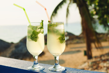 Two glasses of famous Cuban cocktail - Mojito.