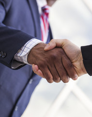 Close-up of handshake between two businessmen