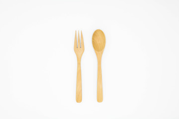 Wooden spoon and fork isolated on white background